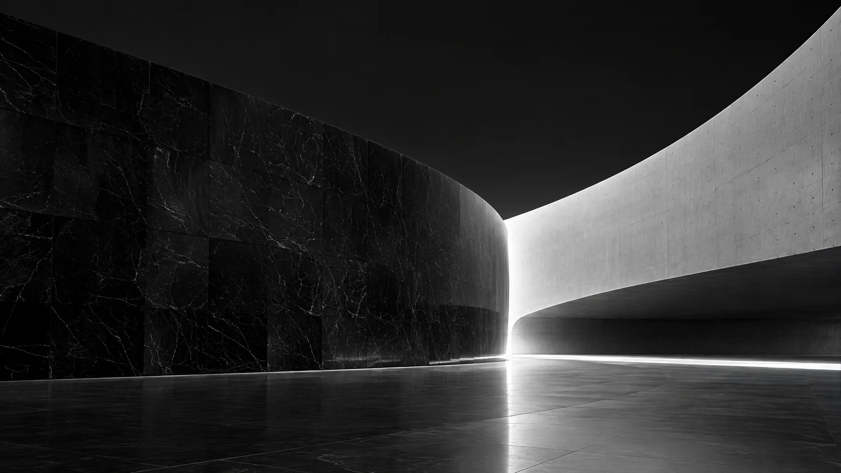 Two sculptural black and white architectural forms in balance